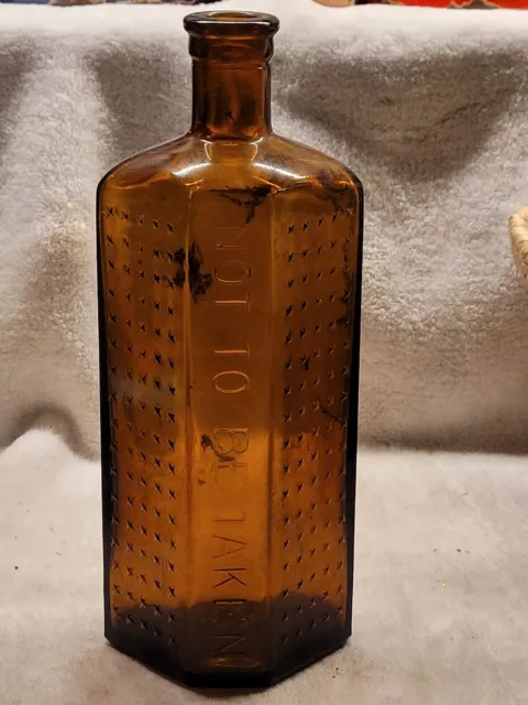 Large 8" Amber "Not To Be Taken" Embossing Flat Back Coffin Poison Bottle
