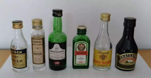 MINIATURE GLASS ALCOHOL BOTTLES x 6  PLEASE SEE PHOTOS