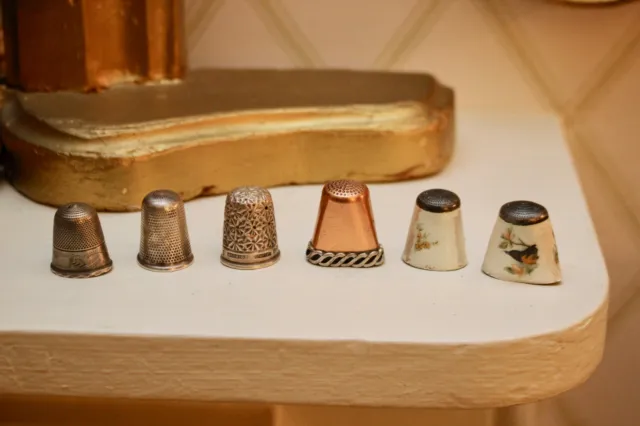 A Group of Antique Silver and Copper Thimbles in Distress