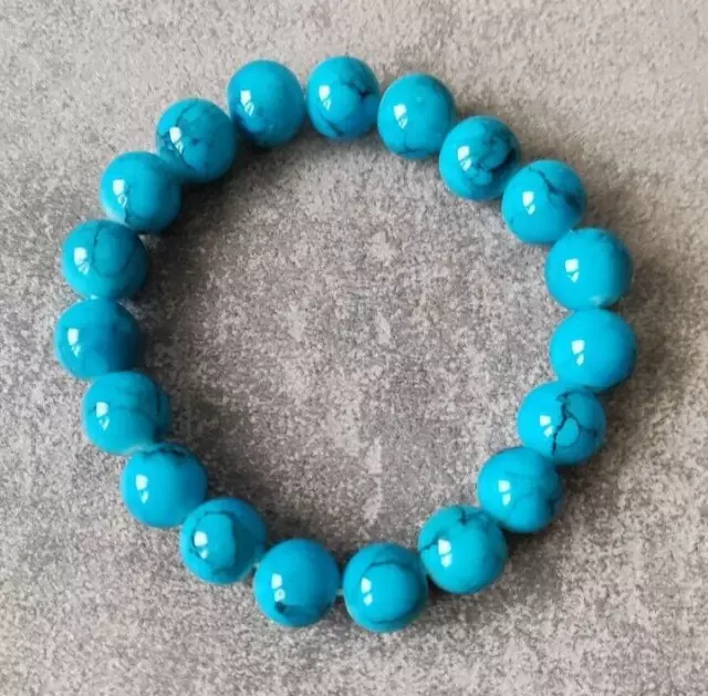 Bracciale elasticizzato con perle in vetro azzurro con effetto marmo