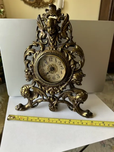Antique Bronzed Cast Iron Victorian Shelf Mantle Clock Ornate Cherub and 2 Faces