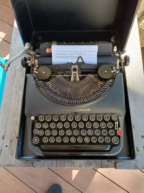 Vintage Remington 5 portable typewriter with leather skinned carry case