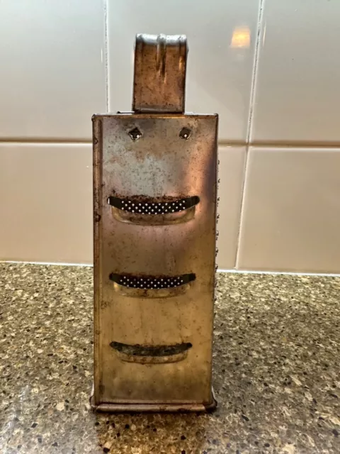 https://www.picclickimg.com/z84AAOSwcq1kAkkq/Vintage-Cheese-Grater-4-Sided-Metal-Shredder-Rustic.webp