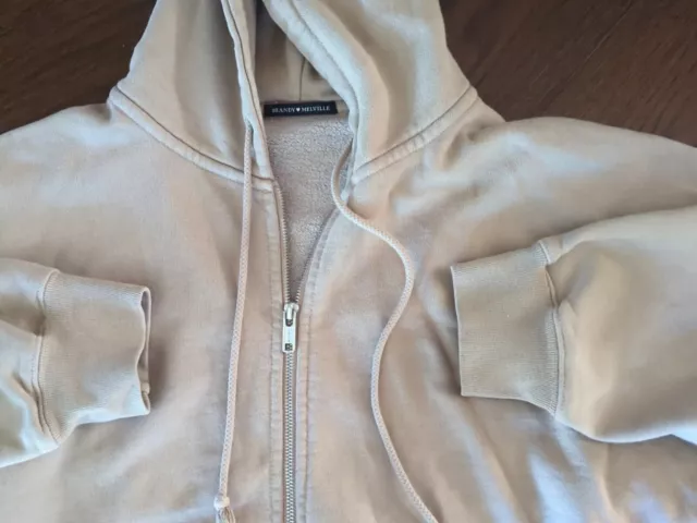 https://www.picclickimg.com/z9AAAOSwjIdlQtve/Brandy-Melville-Tan-Zip-Up-Oversized-Carla-Hoodie.webp