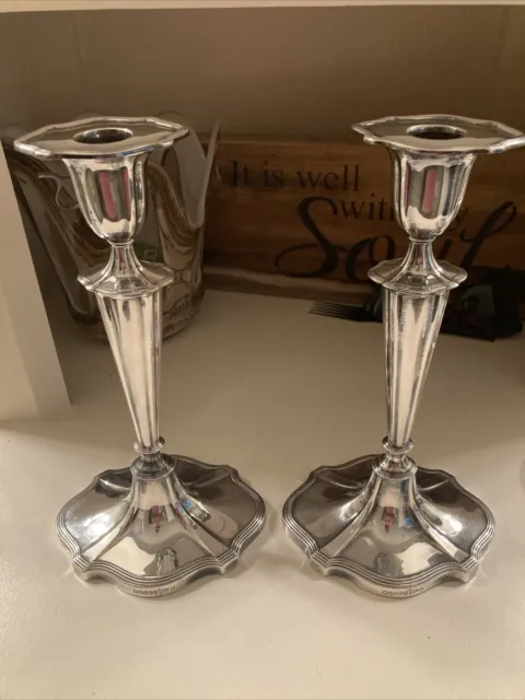 A Pair Of Antique Walker & Hall Silver Plated Candlesticks