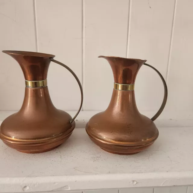 Pair small Vtg mini Copper Jugs rustic charm brass trim pitchers county kitchen