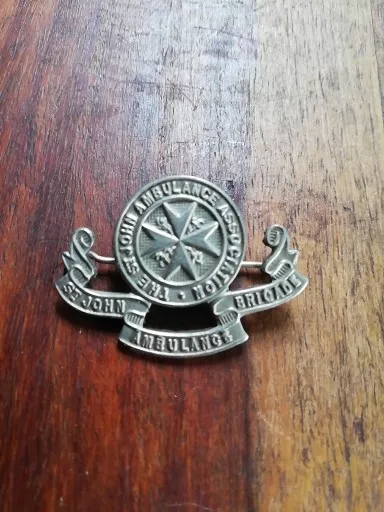 Vintage Silver Tone Metal Badge The St John Ambulance Association Brigade