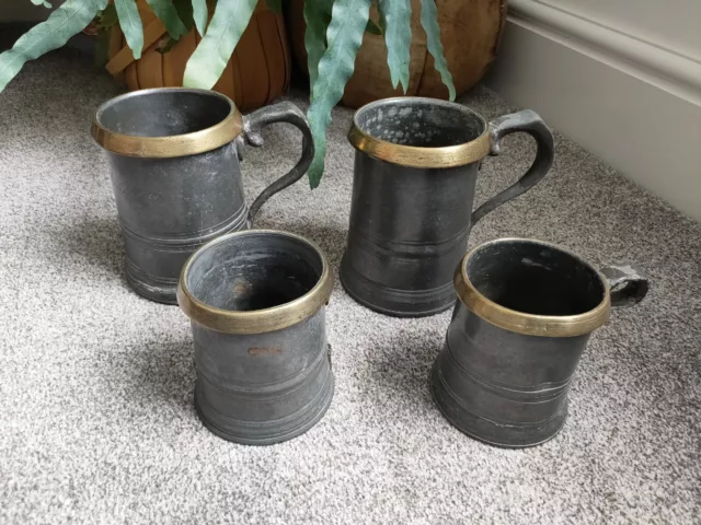 Two antique Victorian Pewter Quart Pewter & Brass Tankards. Brass rim 2 Small
