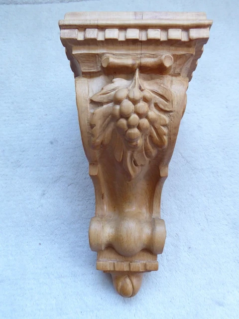 Decorative carved wooden corbel, shelf support, vine leaves, grapes