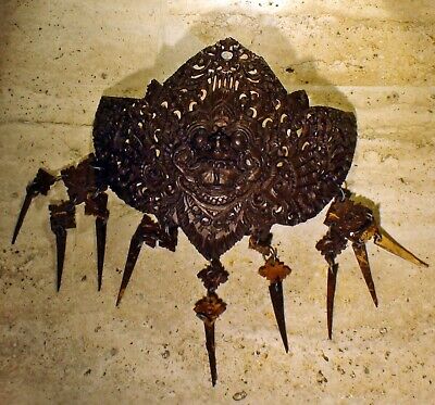 Antique religious Indonesian Garuda set made of a coconut and coconut tassels