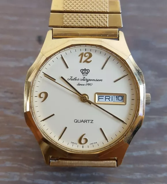 JULES JÜRGENSEN Since 1740 Gold Tone Day Date Beige Dail Stretch Band Watch