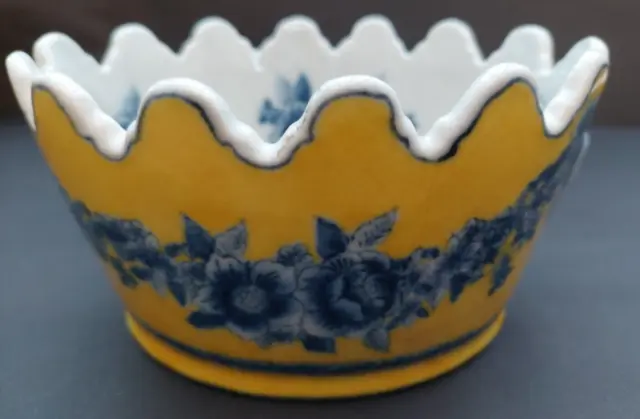 A Chinese hand painted old bowl with two head handles and reign mark on the base