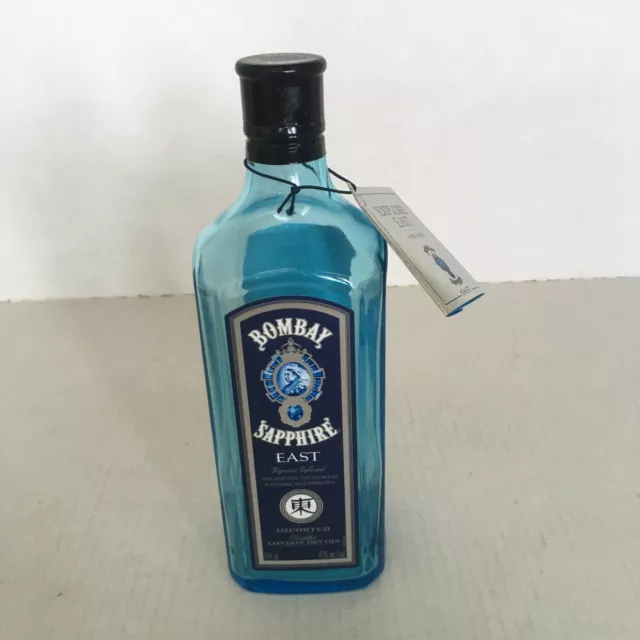 Empty Bombay sapphire east gin bottle blue bottle with etching screw cap