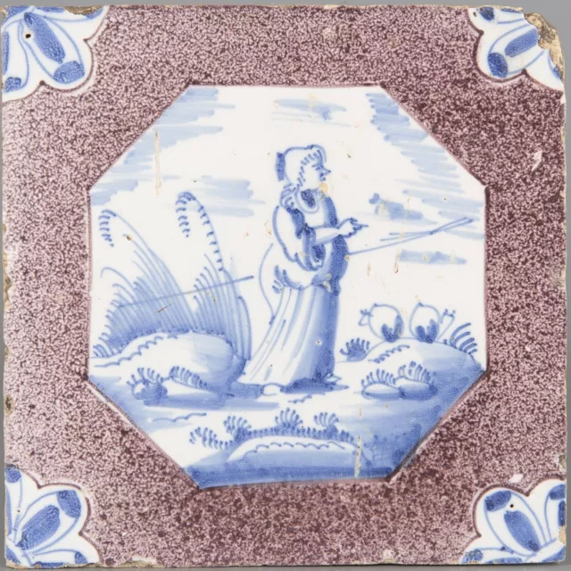 Nice Dutch Delft manganese and blue tile, shepherdess and sheep, 18th century.