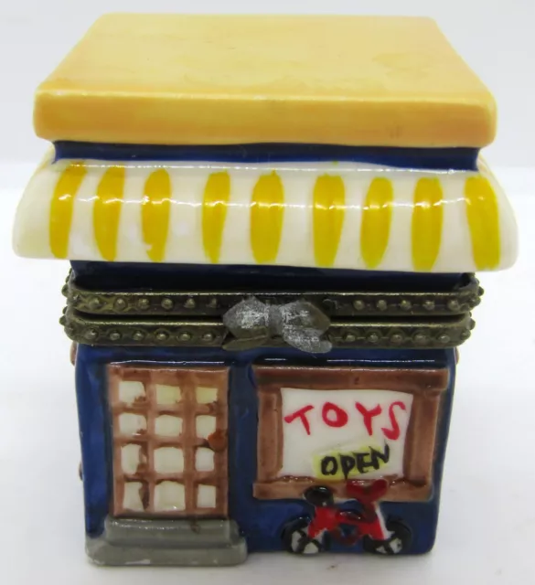 Porcelain Hinged Trinket Box Toy Store With Doll And Drum ￼