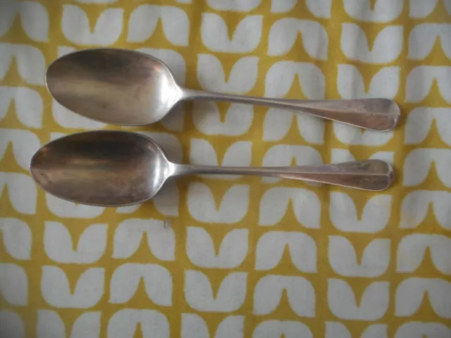 Pair of Mappin & Webb rat tail dessert spoons. Silver plate.