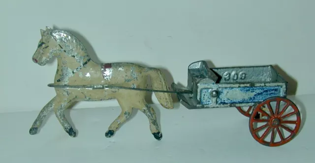 American Hand Painted 19th Century Tin Toy Horse With Cast Iron Wagon