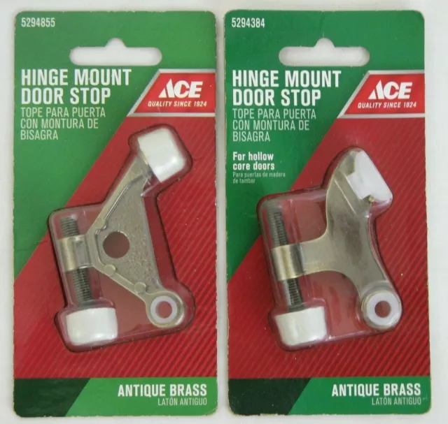 Two Ace Hinge Mount Door Stops in Antique Brass 1 Brushed 1 Textured Finish