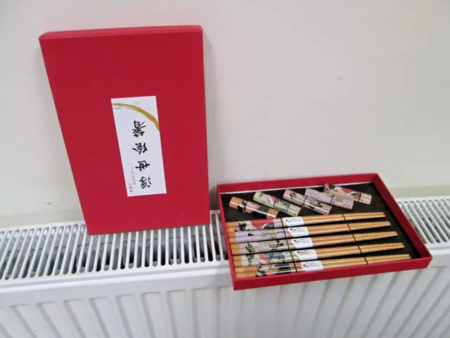 Five pairs of chopsticks  With holders/rests/stands in box  New