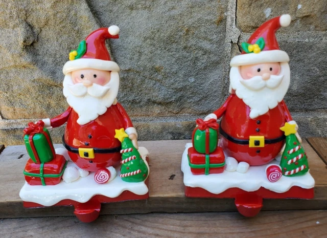 Vtg pair of Solid Cast Iron Santa Claus Stocking Holder Christmas