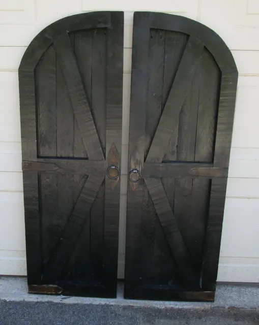 Pair of vintage inspired round top barn doors with hardware wall decor
