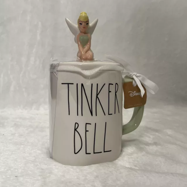 https://www.picclickimg.com/zioAAOSw70tkXD6i/Rae-Dunn-Disney-Tinker-Bell-Mug-With-Topper.webp
