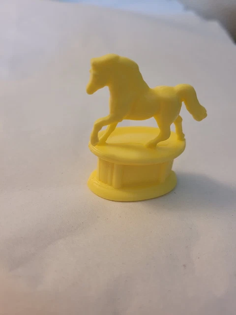 Miniature plastic horse on pedestal statue yellow