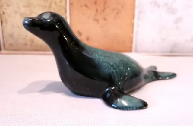 Ceramic Sea Lion Figurine Blue Mountain Pottery, Canada. 17 cm long.Green glaze.