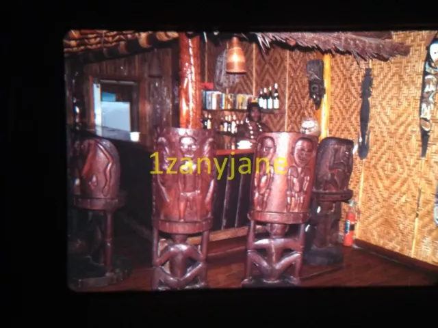 3S12 VINTAGE Photo 35mm Slide INTERIOR NG LODGE WOODEN TIKI STATUES BAMBOO WALLS