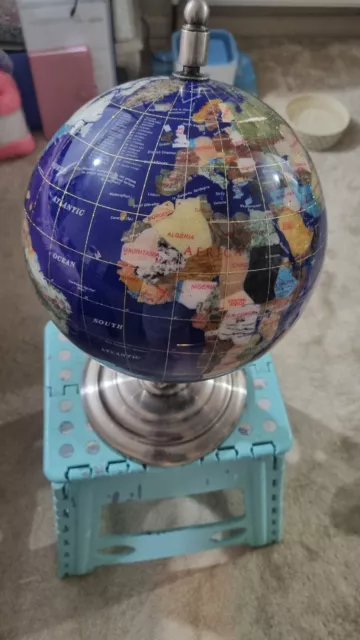 Gemstone globe On Silver Stand