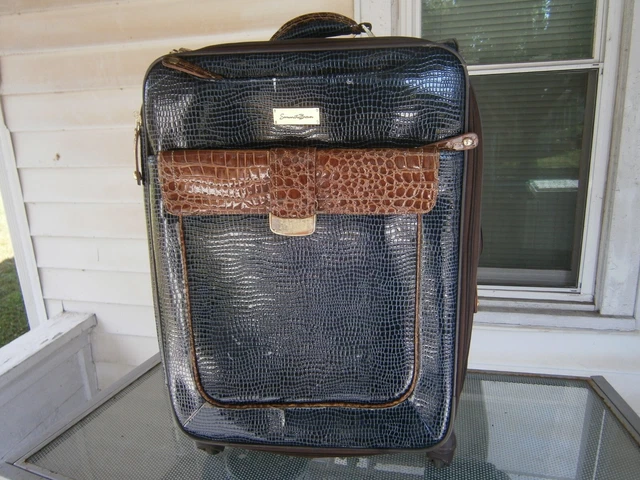 Large Samantha Brown luggage, lots of wear