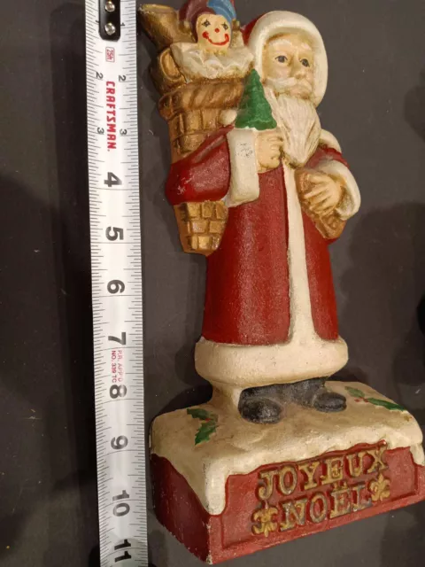 Vintage Kurt S. Adler 1988 cast iron Santa door stop. 11" high.