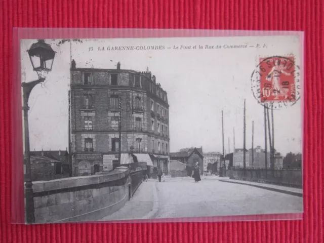 Cpa Ecrite Timbre La Garenne Colombes Le Pont Et La Rue Du Commerce 92