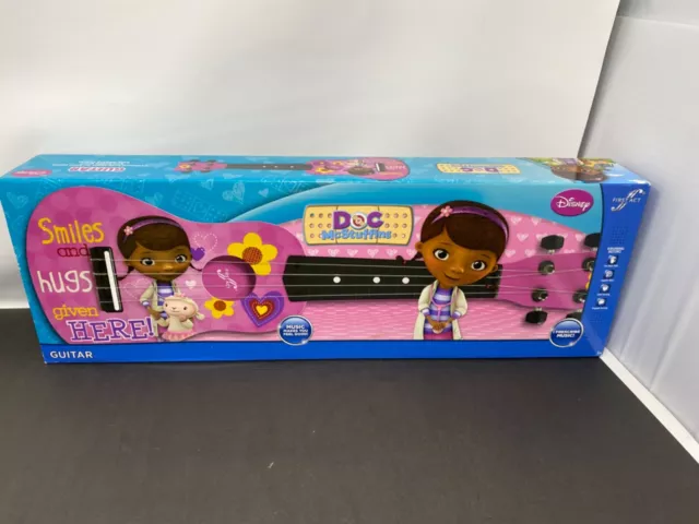 Disney Doc mcstuffins MUSICAL MINI GUITAR  First Act 4 string guitar NEW SEALED