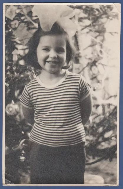 Beautiful Girl with a bow is smiling, cute baby Soviet Vintage Photo USSR