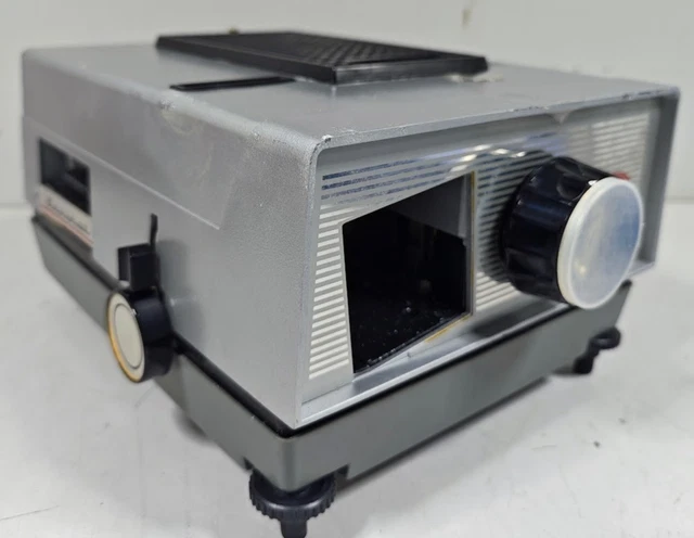 A vintage Paximat-S electric slide projector from Braun Nurnberg with Stellar 1:2,8/85 lens. Housed