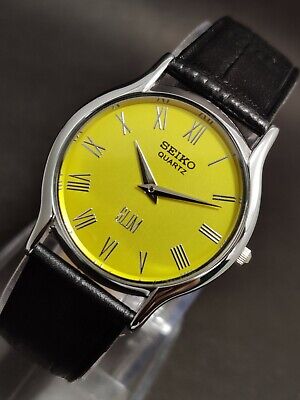 Vintage Seiko Slim Quartz Wrist Watch Silver Japan Made Roman Yellow Dial