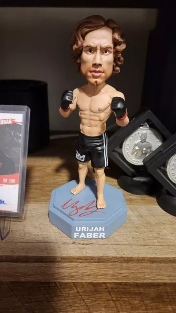 Urijah Faber Autographed MMA Bobblehead Signed. UFC 69/600 VIP numbered.