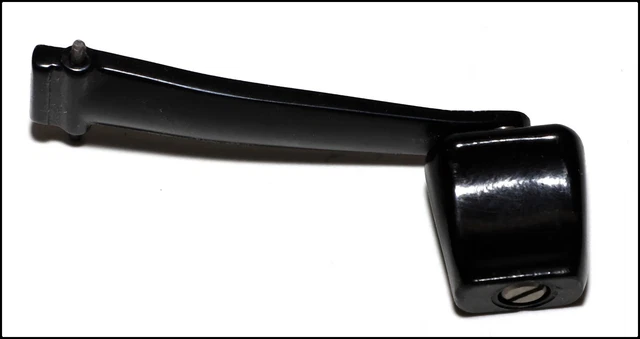 Looks like (but I'm not sure) a Hasselblad black metal winding arm, crank.