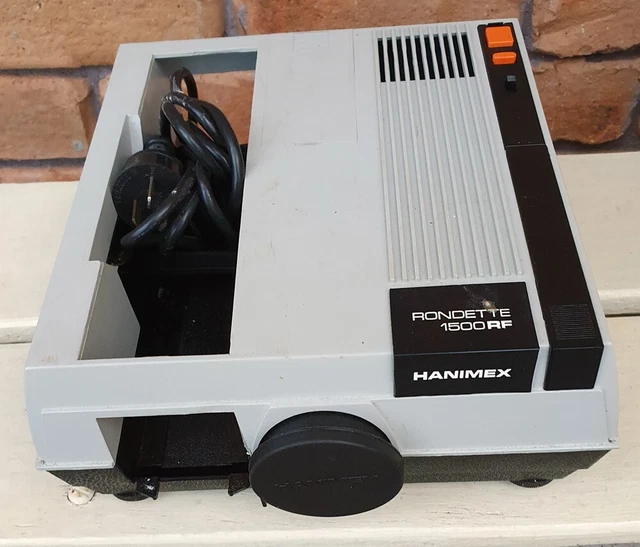 Hanimex Rondette 1500RF Projector, magazines(3), Spare bulbs.  Good Order