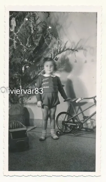 Vintage photo mistake motion blur - little girl by Christmas tree with head move