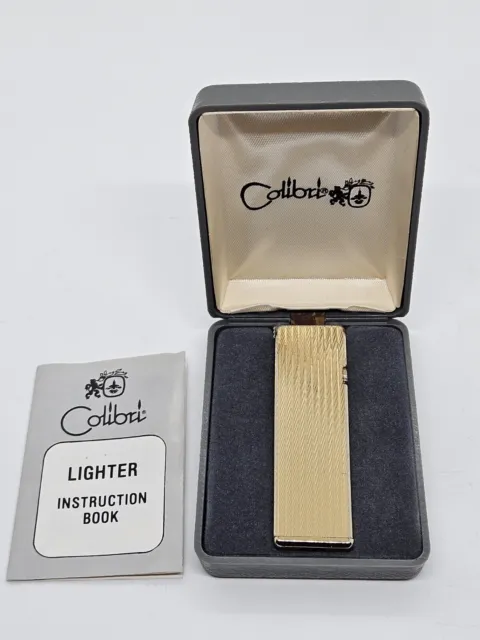 Vintage COLIBRI Gold Tone Slim Cigarette Lighter with Original Box & Instruction