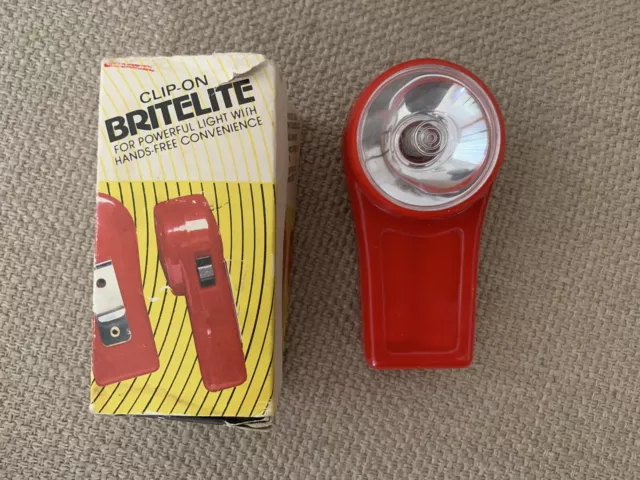 Vintage clip on britelite bright light plastic torch but works well, battery pwr