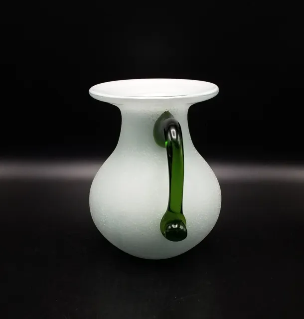 White cased glass textured round vase with applied green glass handle