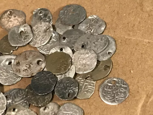 Three Ancient Silver Islamic  Coins in  sleeves  some holed