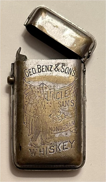 1900s Geo. Benz & Sons Uncle Sam's Monogram Whiskey Push Button Vesta Matchsafe 1900s Geo. Benz & Sons Uncle Sam's Monogram Whiskey Push Button Vesta Matchsafe
