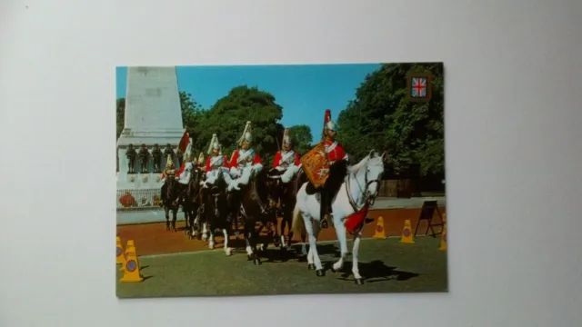 A vintage postcard of The Life Guards Parade,London,England.