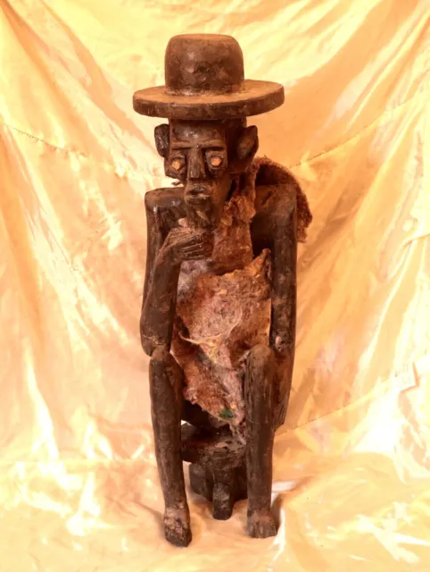 African Wooden Statue Terrifying Man Sit Wearing Hat & Burlap Hand Carved Decor
