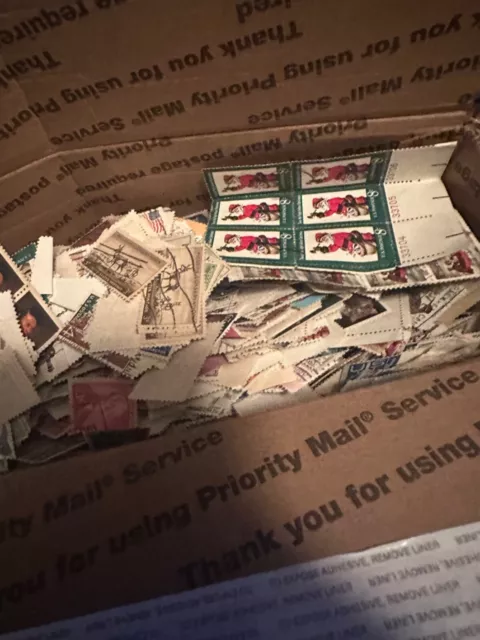 box lot of us stamps off paper thousands of stamps