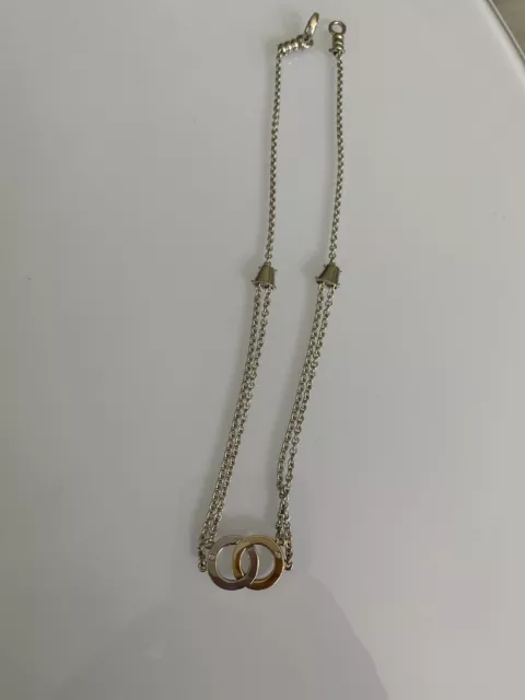 Movado Sterling Silver 18k Gold Diamond Infinity Pendant Necklace. Movado Sterling Silver 18k Gold Diamond Infinity Pendant Necklace.